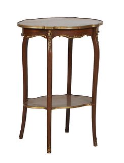 French Louis XV Style Ormolu Mounted Marquetry Inlaid walnut Side Table, early 20th c., the brass bound tortoise top on four cabriole legs joined by a