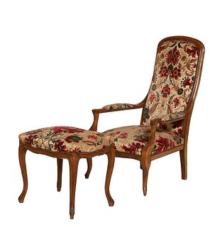 French Louis XV Style Carved Beech Voltaire Armchair, 19th c., the canted arched cushioned back to upholstered curved arms over a bowed seat, on cabri