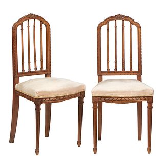 Pair of French Louis XVI Style Carved Walnut Bedroom Chairs, the arched vertical spindled back over a bowed upholstered seat, on turned tapered reeded