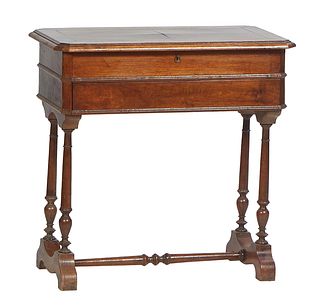 French Louis Philippe Carved Walnut Travailleuse, 19th c., the stepped canted corner mirrored lid lifting to a compartmented interior, over a drawer, 