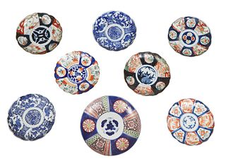 Group of Eight Japanese Imari Porcelain Plates, 19th c., consisting of six scalloped examples, one Arita example, and one charger, Charger- H.- 1 3/4 