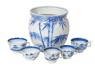 Five Pieces of Japanese Blue and White Porcelain, 20th c., consisting of two teacups, two bowls, and a large bamboo decorated baluster jardiniere, Jar