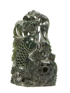 Large Oriental Carved Dark Jade Fish, 20th c., depicting four fish and undersea life, with pierced carving, H.- 12 1/4 in., W.- 7 3/4 in., D.- 3 in.