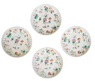 Set of Four Chinese Porcelain Famille Rose Saucers, 20th c., of ribbed form, with floral and grasshopper decoration, the underside with a red Daoguang
