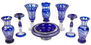 Group of Eight Pieces Cobalt Cut-to-Clear Glass, 20th c., consisting of a pair of candlesticks; a pair of footed trumpet vases; a large center bowl; a