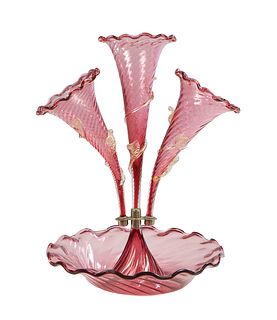 Victorian Cranberry Glass Three Arm Epergne, c. 1900, the central scalloped floriform vase flanked by two scalloped floriform vases with applied clear