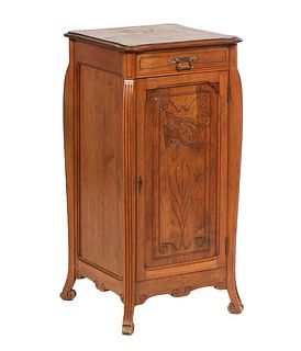 French Carved Walnut Art Nouveau Confiturier, early 20th c., the stepped cookie corner top over a frieze drawer and an incised fielded panel cupboard 
