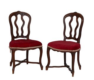 Pair of French Louis XV Style Carved Oak Side Chairs, early 20th c.,with an arched floral carved crest rail over two vertical arched splats, to a bowe