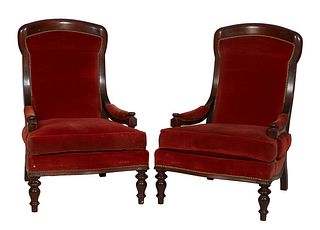 Pair of French Louis Philippe Carved Walnut Fauteuils, 19th c., the curved canted upholstered back to upholstered arms and a removable seat cushion, o