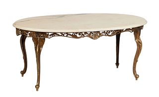 French Louis XV Style Marble Top Brass Coffee Table, 20th c., the stepped figured creme oval marble over a pierced relief skirt, on relief decorated c