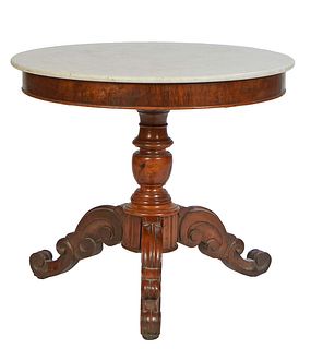 French Louis Philippe Carved Walnut Marble Top Center Table, 19th c., the figured white circular marble over a wide skirt, on a tapered urn with scrol