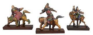 Group of Three Chinese Glazed Ceramic Earthenware Roof Tiles, 19th c., consisting of two men riding dragons, and a woman riding a reindeer, Largest Ma