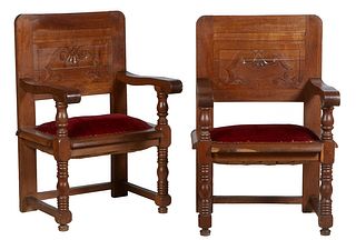 Pair of French Provincial Carved Oak Armchairs, 19th c., the high rounded corner back with a carved scrolled panel, to large scrolled flat arms, over 