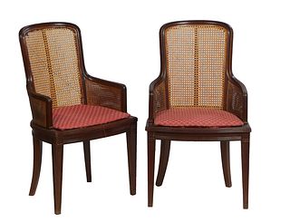 Pair of French Louis Philippe Carved Cherry Fauteuils, 20th c., the canted carved back flanked by carved arms, to bowed slip seats, on square tapered 