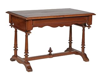 French Provincial Henri II Style Carved Walnut Side Table, c. 1880, the stepped rectangular top over a wide scalloped skirt, on turned tapered trestle
