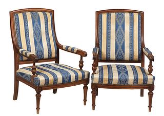 Pair of French Louis XVI Style Carved Walnut Fauteuils, 20th c., the arched canted upholstered back over upholstered scrolled arms, to a bowed seat, o