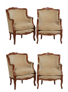 Set of Four Louis XV Style Carved Beech Bergeres, 20th c., the serpentine floral carved crestrail above a rounded back and upholstered arms, to a bowe