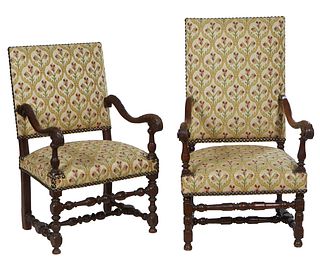 Near Pair of French Louis XIV Style Carved Oak Fauteuils, early 20th c., the rectangular upholstered back over scrolled arms, to a trapezoidal upholst