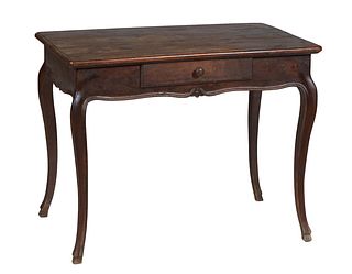 French Provincial Louis XV Style Carved Oak Writing Table, 19th c., the stepped rounded corner rectangular top over a scalloped skirt, with one frieze