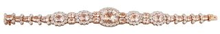 14K Rose Gold Link Bracelet, of Oscar Friedman design, with ten links with oval morganites flanked by two round diamonds to a floriform link with an o