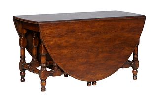 Large English Carved Oak Jacobean Style Drop Leaf Dining Table, early 20th c., the oval top on turned and block legs, joined by like stretchers, H.- 3
