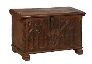 French Renaissance Style Carved Oak Coffer, 19th c., the stepped rounded edge lid over a Gothic arch carved front panel with original iron lock plate,