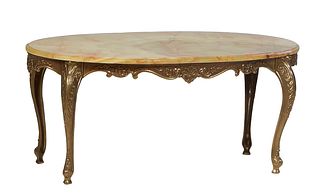 French Green Onyx and Brass Coffee Table, 20th c., the stepped oval highly figured circular top with four "cookie" edges, over a relief skirt, on reli