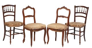 Set of Four French Henri II Carved Walnut Dining Chairs, c. 1880, the curved canted spindled back over a cushioned seat, on turned tapered legs joined
