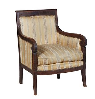 French Provincial Empire Style Walnut Bergere, 19th c., the crest rail over a cushioned back to scrolled upholstered arms flanking a bowed seat with a