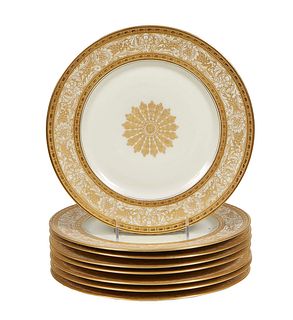 Set of Eight Bavarian Raised Gilt Porcelain Service Plates, 20th c., the scrolled and gilded medallion center and border framed in raised gilt edges, 