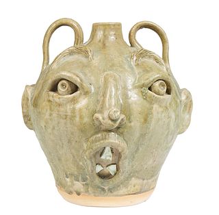 Vicki Miller (N. Carolina), pottery double sided face jug, with teeth, 20th c., titled on the underside ,"Double Trouble," and inscribed "Vicki Miller