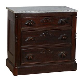 American Carved Mahogany Marble Top Washstand, c. 1880 the figured white marble over three graduated drawers with fruit carved pulls, on a plinth base