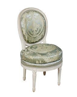 French Polychromed Beech Louis XVI Style Side Chair, 20th c., the canted medallion cushioned back over a bowed seat with a removable seat cushion, on 