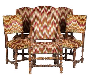 Set of Five Louis XIII Style Carved Oak Dining Chairs, 20th c., consisting of a fauteuil with an arched canted back over curved scrolled arms, on turn
