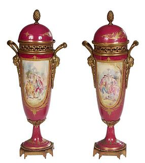 Pair of Bronze Mounted Covered Sevres Vases, early 20th c., of tapered form with a magenta ground, the domed lid with a bronze artichoke finial, above