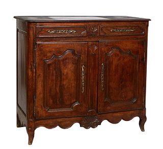 French Provincial Louis XV Style Carved Oak Sideboard, 19th c., the stepped rounded edge three board top over two frieze drawers with long iron escutc