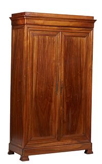 French Provincial Louis Philippe Carved Walnut Armoire, 19th c., the plinth top over a stepped crown above double paneled doors, on stepped ogee block
