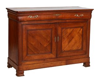French Provincial Louis Philippe Carved Cherry Sideboard, 19th c., the canted corner two board top over a large cavetto frieze drawer above double cup