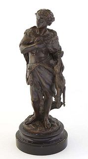Emile Boyer (1877-1948, French), "Young Hunter with his Catch," patinated bronze, signed on the proper right front of the integral base, on a circular