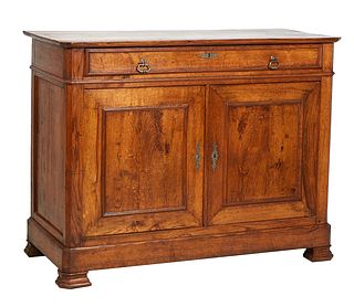 French Provincial Louis Philippe Carved Oak Sideboard, 19th c., the canted corner three board top over a long frieze drawer above double cupboard door