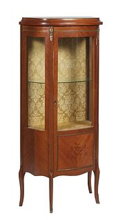 French Louis XV Style Inlaid Ormolu Mounted Carved Walnut Vitrine, 20th c., with a sloping shaped plinth top over a door with a curved glass upper pan