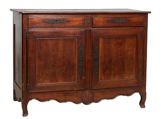 French Provincial Louis XV Style Carved Walnut Sideboard, 19th c., the canted corner three board top over two wide frieze drawers, above double cupboa