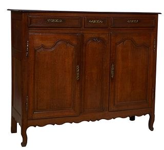 French Provincial Louis XV Style Carved Oak Sideboard, early 20th c., the stepped rounded corner rectangular top over three frieze drawers with brass 