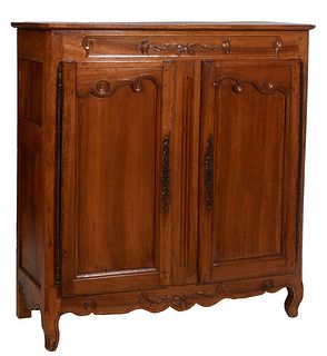 French Provincial Louis XV Style Carved Walnut Sideboard, 19th c., the canted corner top over a floral and scroll carved frieze, above double large cu