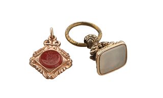 Two Watch Fob Seals, one with a chalcedony insert; the second 10K yellow gold with a carved carnelian insert on one side and an onyx insert on the oth