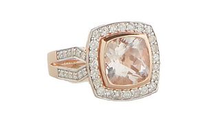 Lady's 14K Rose Gold Dinner Ring, with a cushion cut 4.4 ct. Morganite atop a conforming border of small round diamonds, the split shoulders of the ba
