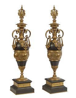 Pair of Bronze and Black Slate Baluster Urn Garnitures, 19th c., the figural top over bronze ring handles and a relief bronze bird, on a stepped recta