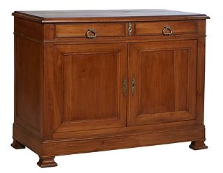 French Provincial Louis Philippe Carved Cherry Sideboard, 19th c., the stepped ogee edge top over two large frieze drawers above double cupboard doors