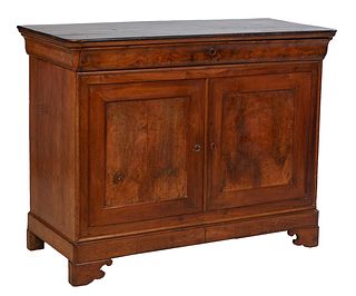 French Provincial Louis Philippe Carved Walnut Sideboard, 19th c., the stepped rounded corner top over a long frieze drawer above double cupboard door