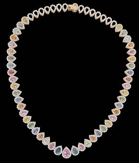 18K Yellow Gold Link Necklace, each of the 45 links with a pear shaped sapphire within a border of round white diamonds, transitioning to 15 pear link